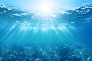 Fototapeta na wymiar Underwater view of blue sea with sunbeams and lens flare