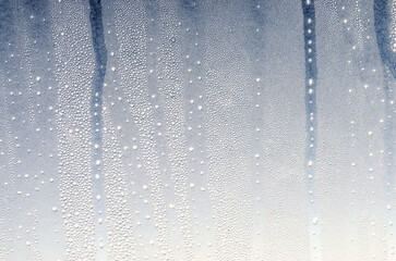 a pattern of frost on the window glass of an airplane