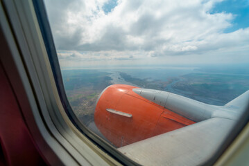 view from the airplane window of the airport during takeoff