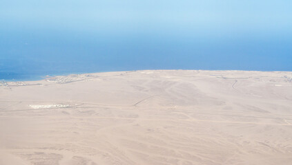 Fototapeta na wymiar view from the plane window of the Red Sea and the desert in Egypt