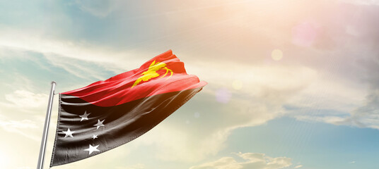 Papua New Guinea national flag cloth fabric waving on the sky - Image