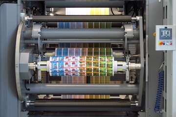 Output rolls of rotogravure and cutting labels printing machine - obrazy, fototapety, plakaty