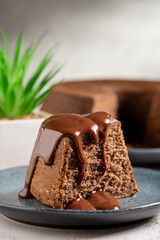 Slice of chocolate cake with chocolate sauce.