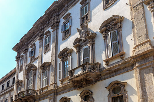 Antique apartment building with stucco in Milan, Italy