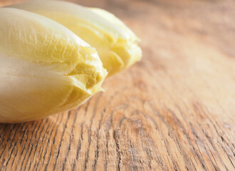 Close up of chicory on a wooden kitchen table