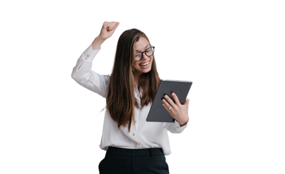 Expressive young businesswoman in glasses, shirt and black pants holding tablet making video call rising fist up against transparent background, celebrating great deal, laughing, screaming
