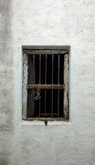 Old House Wooden Window with Iron Rod Bars