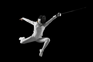 Artistry of combat. Female fencer gracefully executes complex fencing maneuver in action against...