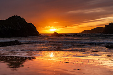 Fototapeta na wymiar Sunset at Porth Dafarch Beach, Isle of Anglesey, Uk