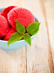 Strawberry ice cream in blue bowl