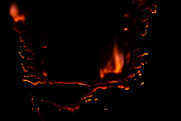 burning paper, glowing edge of paper on a black background