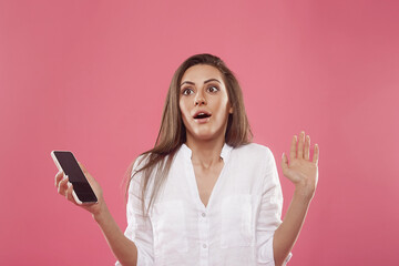 portrait of surprised girl with phone. Scared girl