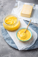 Ghee or clarified butter in jar and bowl. Indian butter.