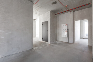 interior of the apartment without decoration in gray colors. rough finish