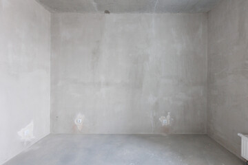 interior of the apartment without decoration in gray colors. rough finish