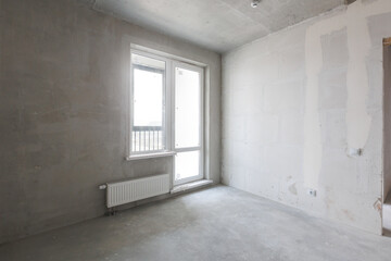 interior of the apartment without decoration in gray colors. rough finish