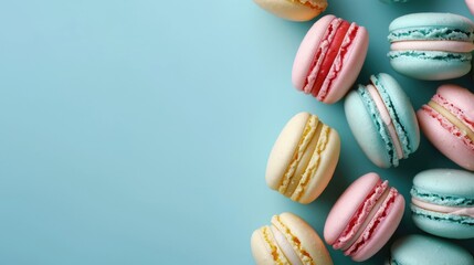 Colourful macarons sweet dessert on pastel background with free place for text. French cuisine,...