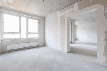 interior of the apartment without decoration in gray colors. rough finish