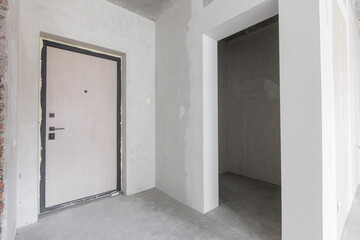 interior of the apartment without decoration in gray colors. rough finish