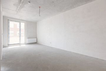 interior of the apartment without decoration in gray colors. rough finish