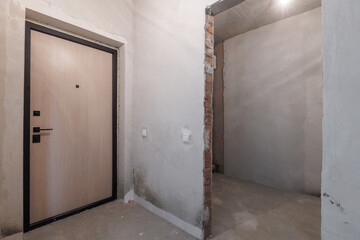 interior of the apartment without decoration in gray colors. rough finish