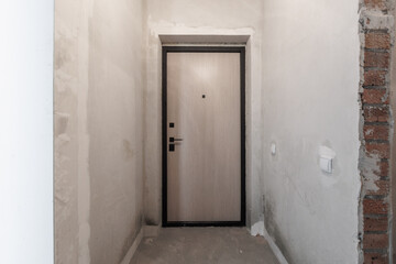 interior of the apartment without decoration in gray colors. rough finish