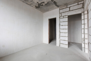 interior of the apartment without decoration in gray colors. rough finish