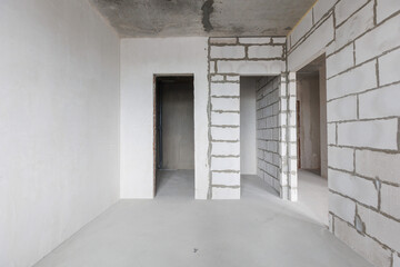 interior of the apartment without decoration in gray colors. rough finish