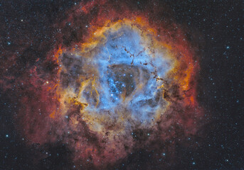 NGC 2244 and NGC 2237 (The Rosette Nebula) in the constellation of Monoceros, 5200 light years away...