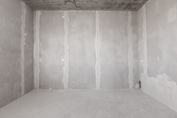 interior of the apartment without decoration in gray colors. rough finish