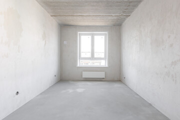 interior of the apartment without decoration in gray colors. rough finish