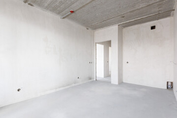 interior of the apartment without decoration in gray colors. rough finish