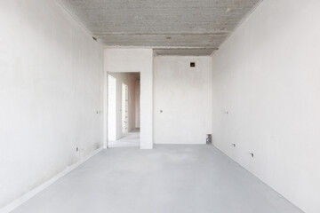 interior of the apartment without decoration in gray colors. rough finish