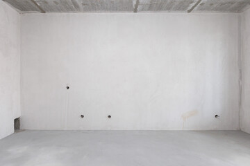 interior of the apartment without decoration in gray colors. rough finish