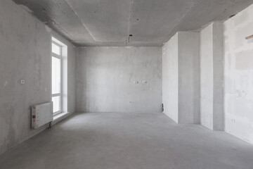 interior of the apartment without decoration in gray colors. rough finish