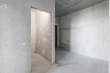interior of the apartment without decoration in gray colors. rough finish