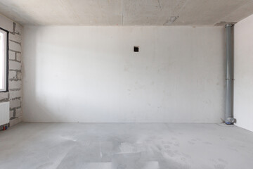 interior of the apartment without decoration in gray colors. rough finish