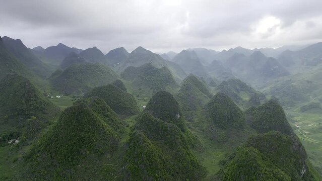 Dramatic green karst mountains in Northern Vietnam aerial drone stock footage 