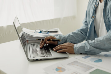 Tax reduction planning ideas Businessman calculating business balance preparing personal tax return...
