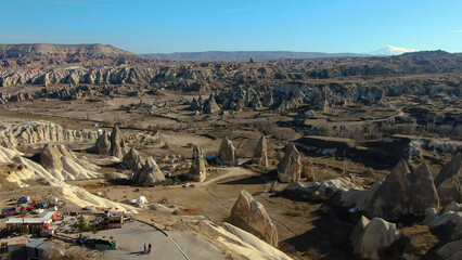 Mesmerizing aerial view of Cappadocia's surreal landscape, with its iconic fairy chimneys.