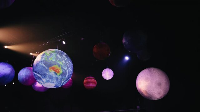 A cool model of the planets of the solar system is hanging indoors, setting the cosmic tone for the event.