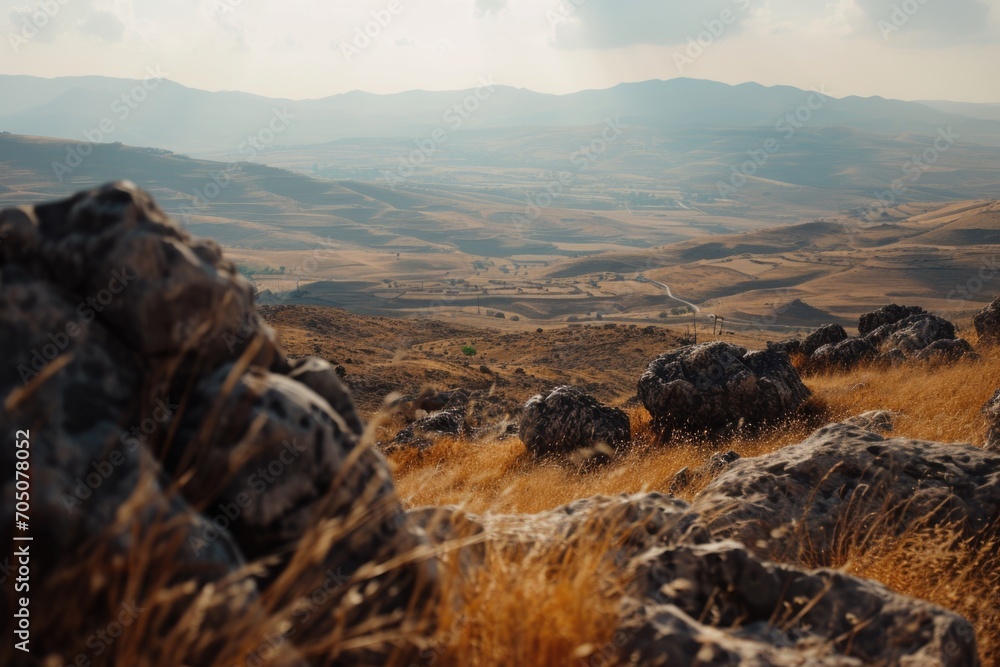 Poster a scenic view of a valley and mountains as seen from a hill. this image can be used to depict the be