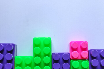 pile of colorful blocks with place for content or text. Top angle view of bricks on white background. copy space