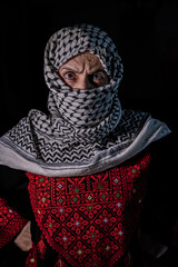 plastanina woman wearing traditional clothes with white keffiyeh on dark background