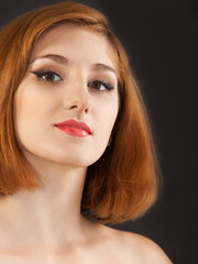 Fototapeta premium Beautiful young woman with red hair