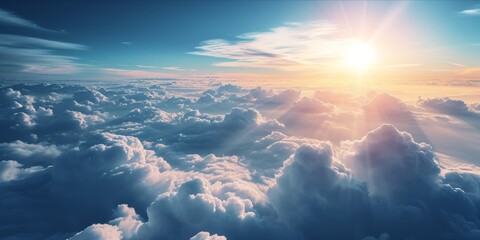A breathtaking view above the clouds with sunlight piercing through. - obrazy, fototapety, plakaty