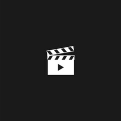Movie clapper icon isolated on black background