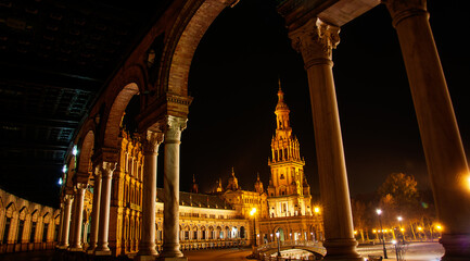 the lights of the night illuminate the beautiful Andalusian city of Seville - obrazy, fototapety, plakaty