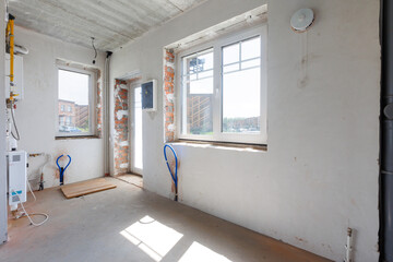 interior of the apartment without decoration in gray colors. rough finish