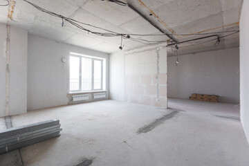 interior of the apartment without decoration in gray colors. rough finish